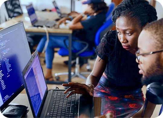 Man and woman working with code